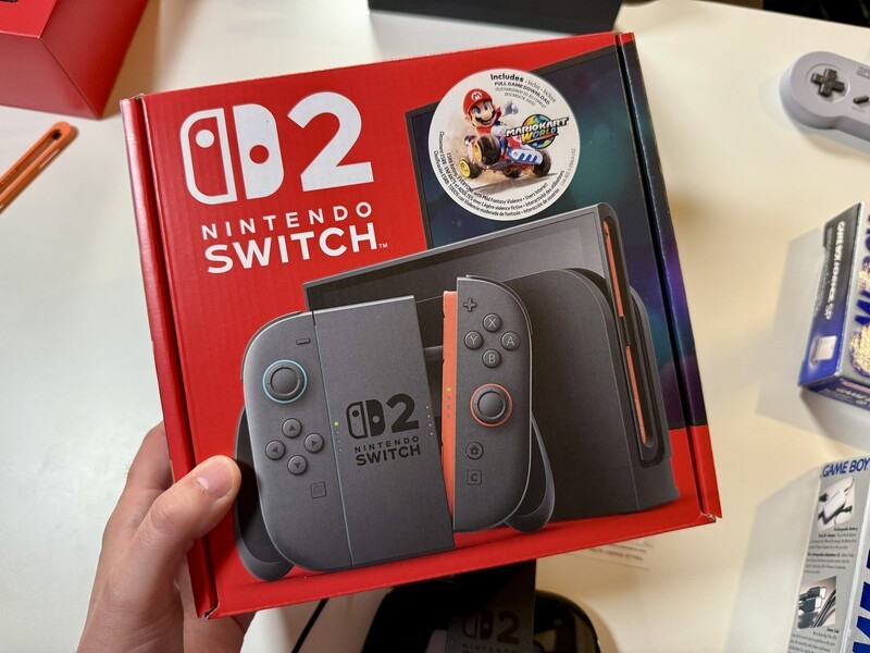 Switch 2 Box In Hand With White Background