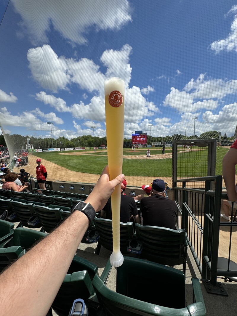Man at Winnipeg Goldeyes Baseball Park w Beer Bat